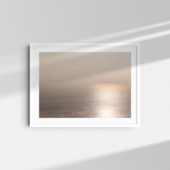 A framed fine art photography print featuring the golden sunset ocean coastline in Malibu, California.