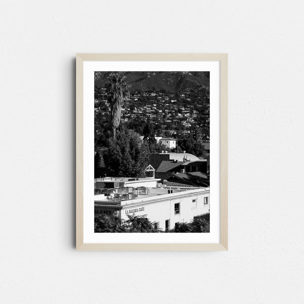 A black and white framed fine art photography print featuring the downtown city area in Santa Barbara, California.